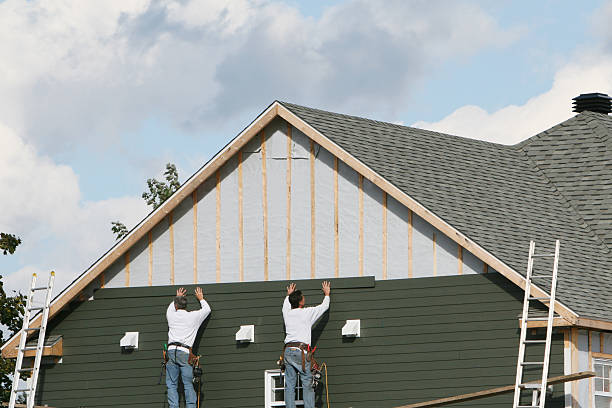 Professional Siding technician working in Sharpes, FL
